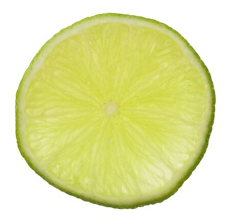 Sliced lime green isolated on white background close-up.の写真素材