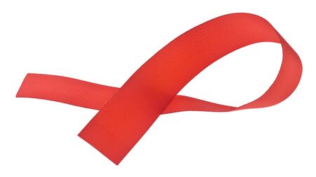 Red ribbon isolated on a white background close-up.の写真素材