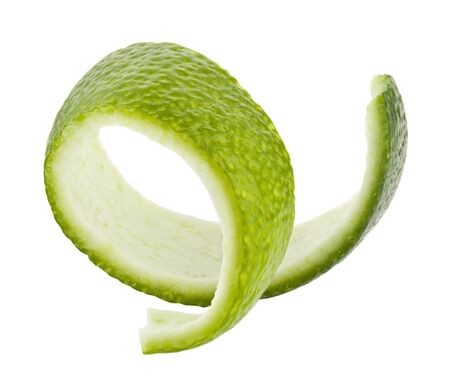 Green lime peel isolated on a white background close-up.の写真素材