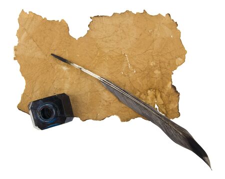 Inkwell with feather and old paper isolated on whiteの写真素材