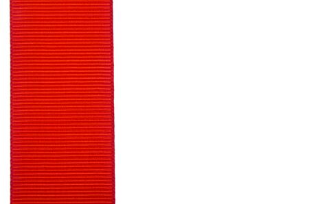 Red ribbon isolated on a white background close-up.の写真素材