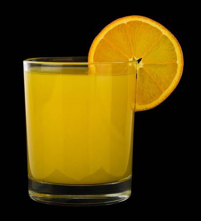 Orange juice isolated on a black background close-up.の写真素材
