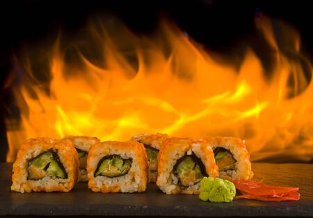 sushi on a black background on fire lose-up.の写真素材