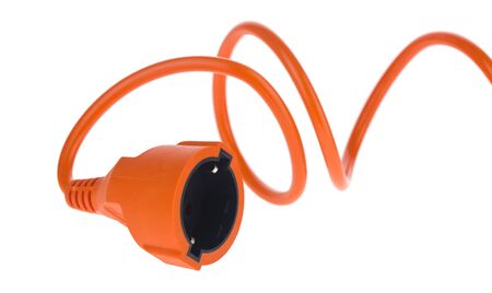 Electric extension cable orange isolated on a white background close-up.の写真素材