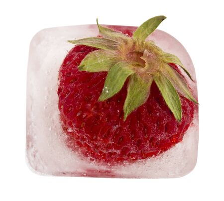 Frozen red strawberries isolated on a white background close-up.の写真素材