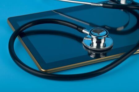Stethoscope on a blue background close-up.の写真素材