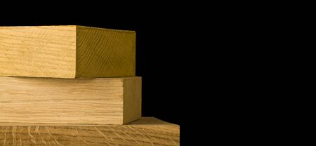 Wooden blocks, boards isolated on a black background.の写真素材