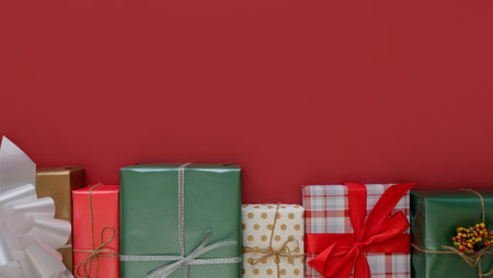 Border with a Christmas box with gifts on a red background with space for text