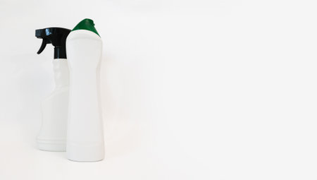Two white plastic bottles on a white background, place for text. Cleaning productsの写真素材