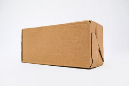 Brown cardboard box on a white backgroundの写真素材
