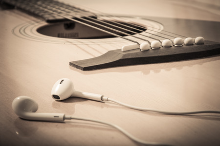 headphone on guitar backgroundの写真素材