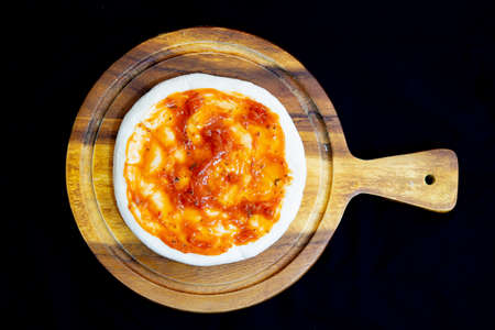 Delicious pizza served on wooden plateの写真素材