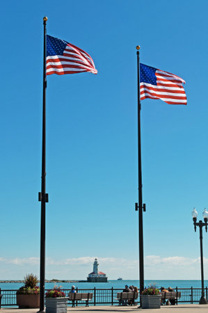 Chicago: American flags and the Chicago Harbor Lighthouse on September 22, 2014のeditorial素材