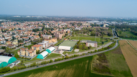 Nature and landscape, municipality of Solaro, Milano: Aerial view of a field, houses and homes, farming, grass green, countryside, farming, trees. italyの写真素材