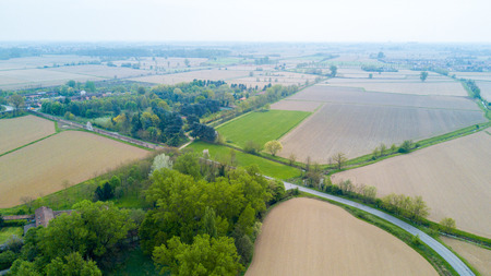 Nature and landscape: Aerial view of a field, cultivation, green grass, countryside, farming, dirt roa. Treesの写真素材
