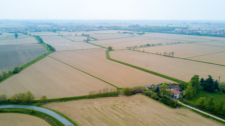 Nature and landscape: Aerial view of a field, cultivation, green grass, countryside, farming, dirt roa. Treesの写真素材