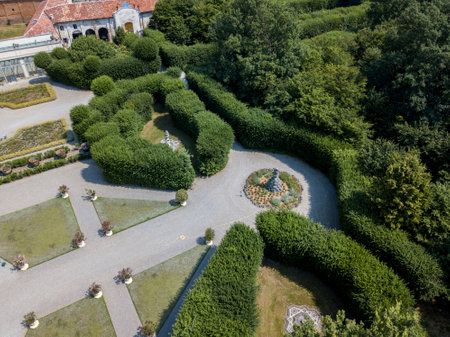 Aerial view of a statue and a flowering garden with flowerbeds and vases, Villa Arconati, Castellazzo, Bollate, Milan, Italyのeditorial素材