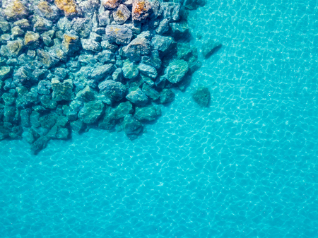 Aerial view of the rocks on the sea. Overview of the seabed seen from above, transparent waterの写真素材