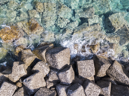 Aerial view of the rocks on the sea. Overview of the seabed seen from above, transparent waterの写真素材