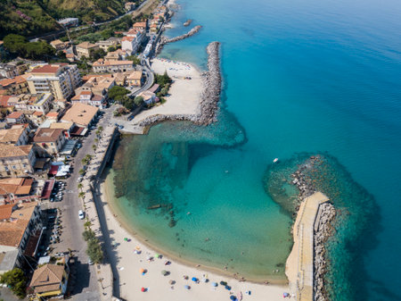 Aerial view of a pier with rocks and rocks on the sea. Pier of Pizzo Calabro, panoramic view from above. Summer sea and tourism on the Calabrian coast of Southern Italy. Calabria, Italyのeditorial素材
