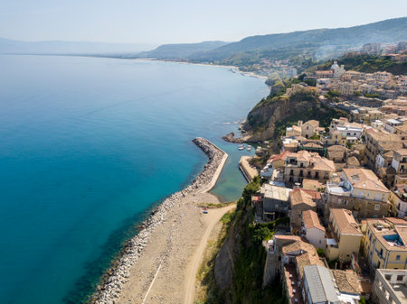 Aerial view of a pier with rocks and rocks on the sea. Pier of Pizzo Calabro, panoramic view from above. Summer sea and tourism on the Calabrian coast of Southern Italy. Calabria, Italyのeditorial素材