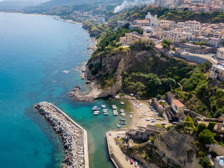 Aerial View of Pizzo Calabro, Calabria, Italy. Houses on rock, harbor and pier with moored boatsのeditorial素材