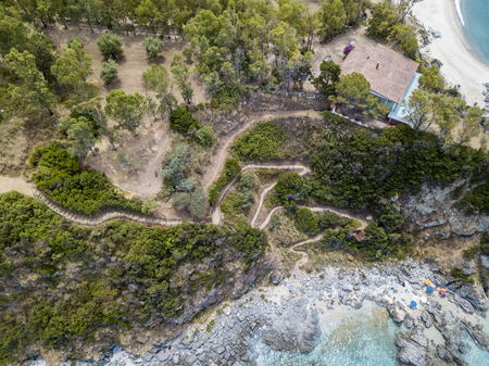 Paradise of the sub, beach with promontory overlooking the sea. Zambrone, Calabria, Italy. Diving relaxation and summer vacations. Italian coasts, beaches and rocks. Aerial viewの写真素材