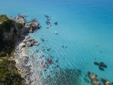 Paradise of the sub, beach with promontory overlooking the sea. Zambrone, Calabria, Italy. Diving relaxation and summer vacations. Aerial viewの写真素材