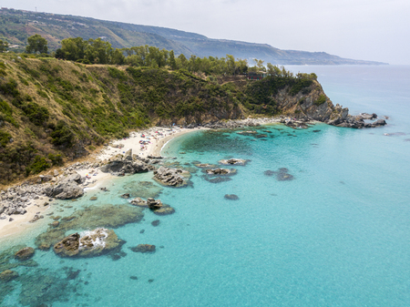 Paradise of the sub, beach with promontory overlooking the sea. Zambrone, Calabria, Italy. Diving relaxation and summer vacations. Aerial viewの写真素材