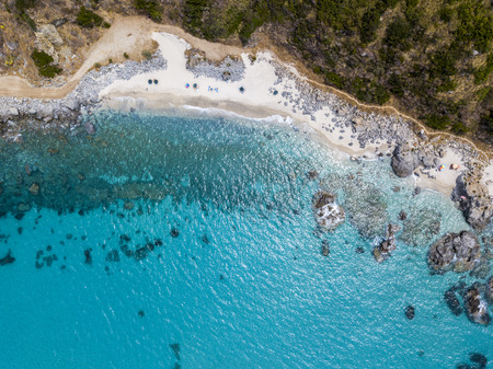 Paradise of the sub, beach with promontory overlooking the sea. Zambrone, Calabria, Italy. Diving relaxation and summer vacations. Aerial viewの写真素材