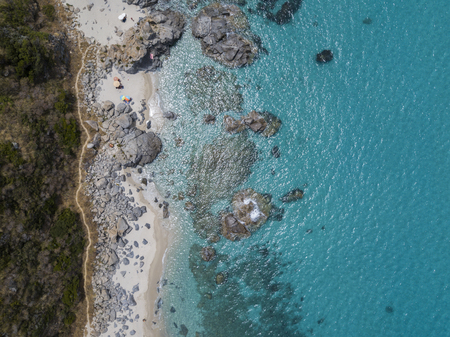 Paradise of the sub, beach with promontory overlooking the sea. Zambrone, Calabria, Italy. Diving relaxation and summer vacations. Aerial viewの写真素材