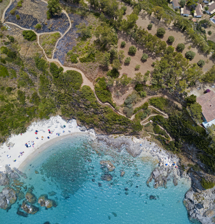 Paradise of the sub, beach with promontory overlooking the sea. Zambrone, Calabria, Italy. Diving relaxation and summer vacations. Aerial viewの写真素材