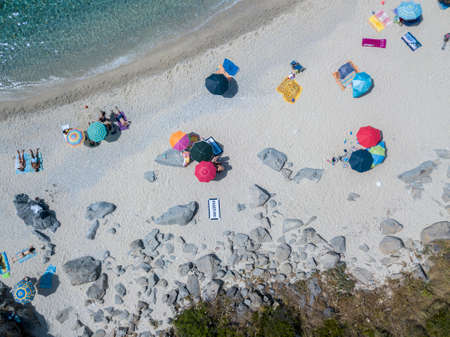Aerial view of a beach. Calabria, Italy. Aerial view of the rocks on the sea. Overview of the seabed seen from above, transparent waterの写真素材