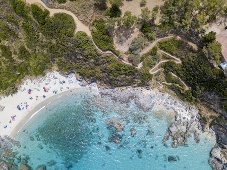Paradise of the sub, beach with promontory overlooking the sea. Zambrone, Calabria, Italy. Diving relaxation and summer vacations. Aerial viewの写真素材