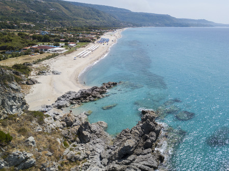 Paradise of the sub, beach with promontory overlooking the sea. Zambrone, Calabria, Italy. Diving relaxation and summer vacations. Aerial viewの写真素材