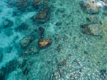 Aerial view of the rocks on the sea. Overview of the seabed seen from above, transparent waterの写真素材