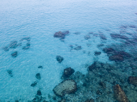Aerial view of the rocks on the sea. Overview of the seabed seen from above, transparent waterの写真素材