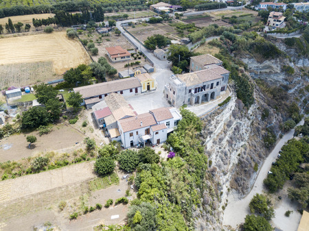 Aerial view of houses on the rock over a promontory overlooking the sea, Ricadi, Capo Vaticano, Calabria. italyの写真素材