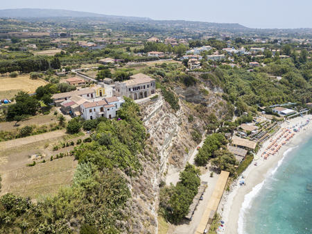Overview of Ricadi Beach, Tower Marino, Vatican City, promontory aerial view, cliffs and sand. Summer vacations in Calabria, Italyの写真素材