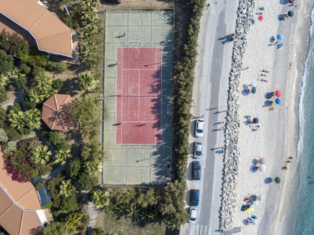 Aerial view of a tennis court and beachの写真素材