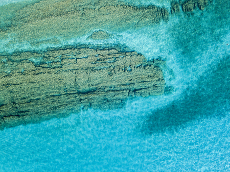 Aerial view of the rocks on the sea. Overview of the seabed seen from above, transparent waterの写真素材