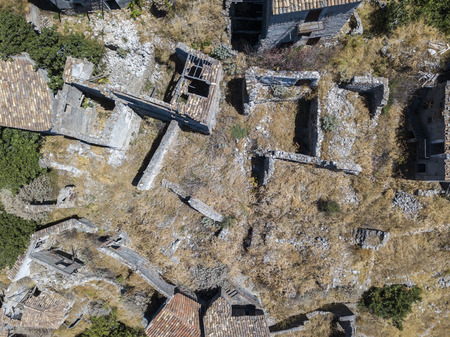 Aerial view of the village of Pentedattilo, church and ruins of the abandoned village, Greek colony on Mount Calvario, whose form recalls the five fingers, the name of the village derives from the Greekの写真素材