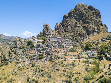 Aerial view of the village of Pentedattilo, church and ruins of the abandoned village, Greek colony on Mount Calvario, whose form recalls the five fingers, the name of the village derives from the Greekの写真素材