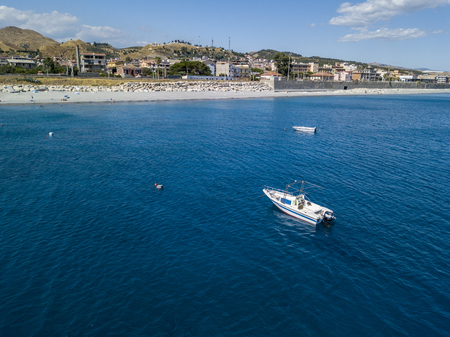 Aerial view of boats moored in Melito of Porto Salvo, coast and hills of Calabria. italyの写真素材