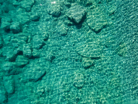 Aerial view of the rocks on the sea. Overview of the seabed seen from above, transparent waterの写真素材