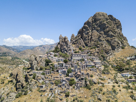 Aerial view of the village of Pentedattilo, church and ruins of the abandoned village, Greek colony on Mount Calvario, whose form recalls the five fingers, the name of the village derives from the Greekの写真素材