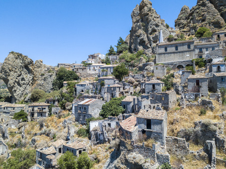 Aerial view of the village of Pentedattilo, church and ruins of the abandoned village, Greek colony on Mount Calvario, whose form recalls the five fingers, the name of the village derives from the Greekの写真素材