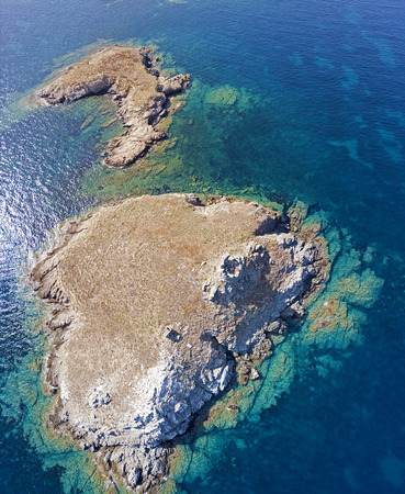 Aerial view of the islands of Finocchiarola, Mezzana, Earth, Peninsula of Cap Corse, Corsica. Tyrrhenian Sea, Uninhabited Islands that are part of the municipality of Rogliano. France.の写真素材