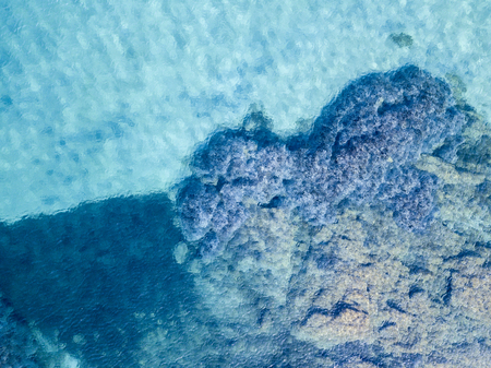 Aerial view of the rocks on the sea. Overview of the seabed seen from above, transparent waterの写真素材