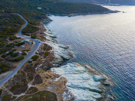 Aerial view of winding roads of the French coast. Barcaggio. Cap Corse Peninsula, the northernmost point of Cap Corse, in front of the island of Giraglia. Corsica. Coastline. franceの写真素材